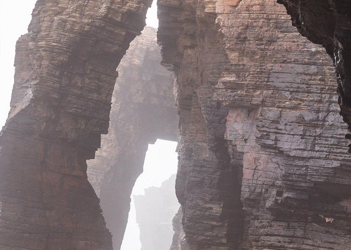 As Catedrais Beach Natural rock arches on Cathedrals beach in low tide, Praia As ... photo