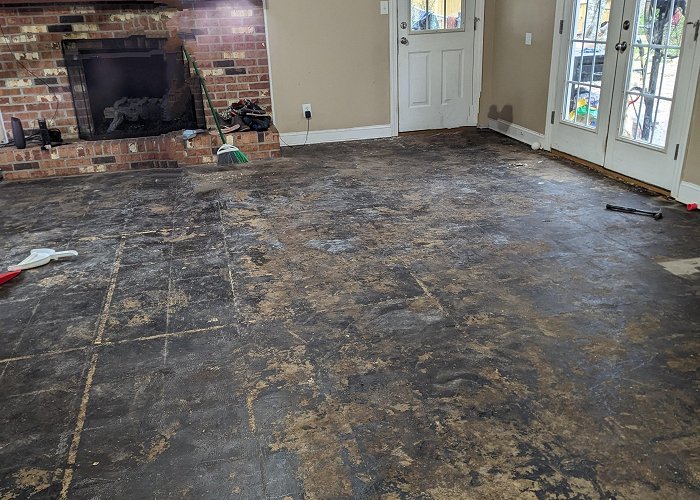 ONCE Attempting to Refinishing Concrete floor that was once a driveway ... photo