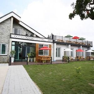 Snow Flower Pension Jeju by Exterior photo